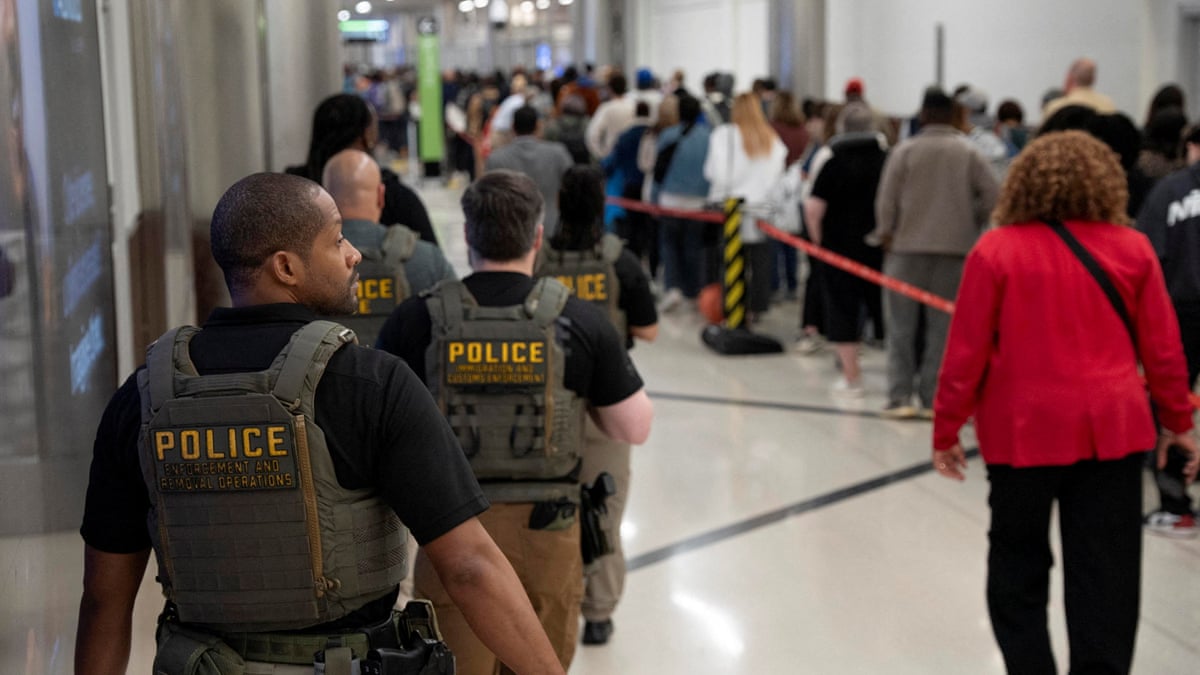 ICE agents are present as passengers wait in a TSA line in Atlanta, Georgia.