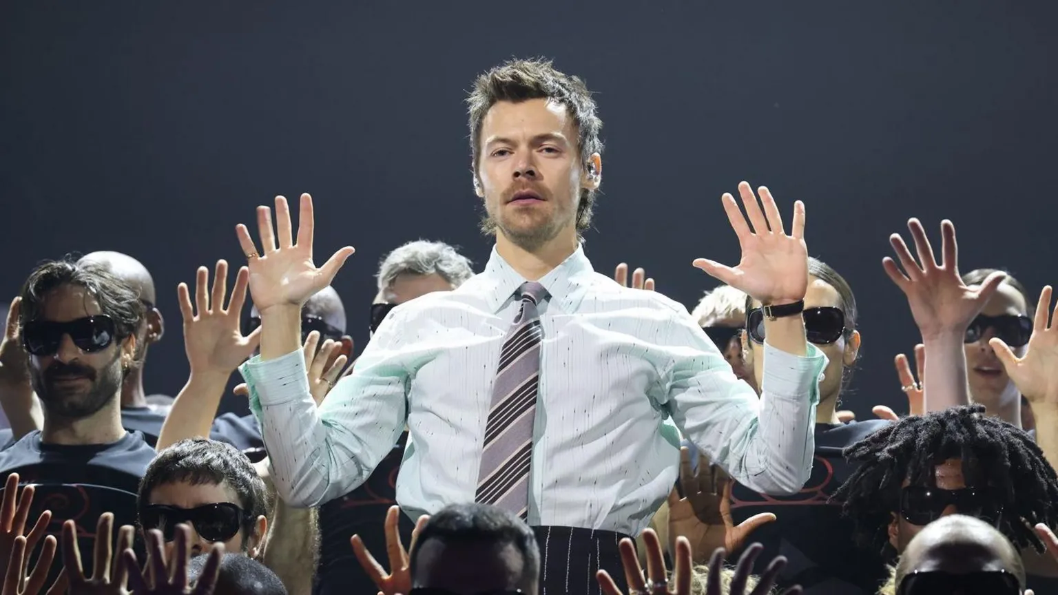  Harry Styles with his hands up, surrounding by dancers during his performance at the Brit Awards at Manchester's Co-op Live Arena last month