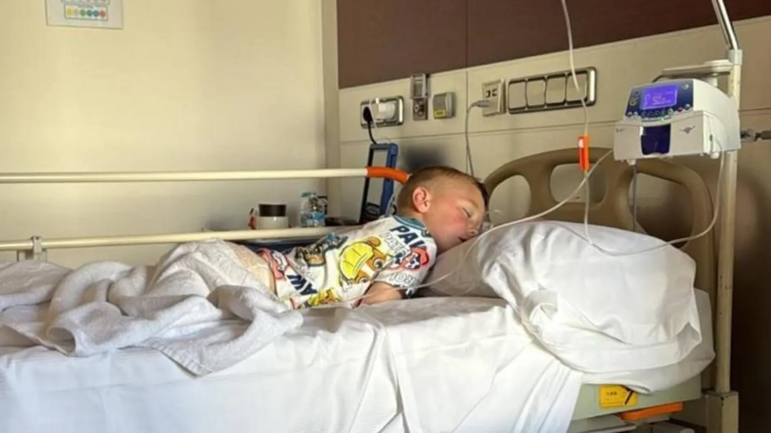 Family photo Michael, in hospital in Spain, after falling ill while on holiday with his parents in 2025