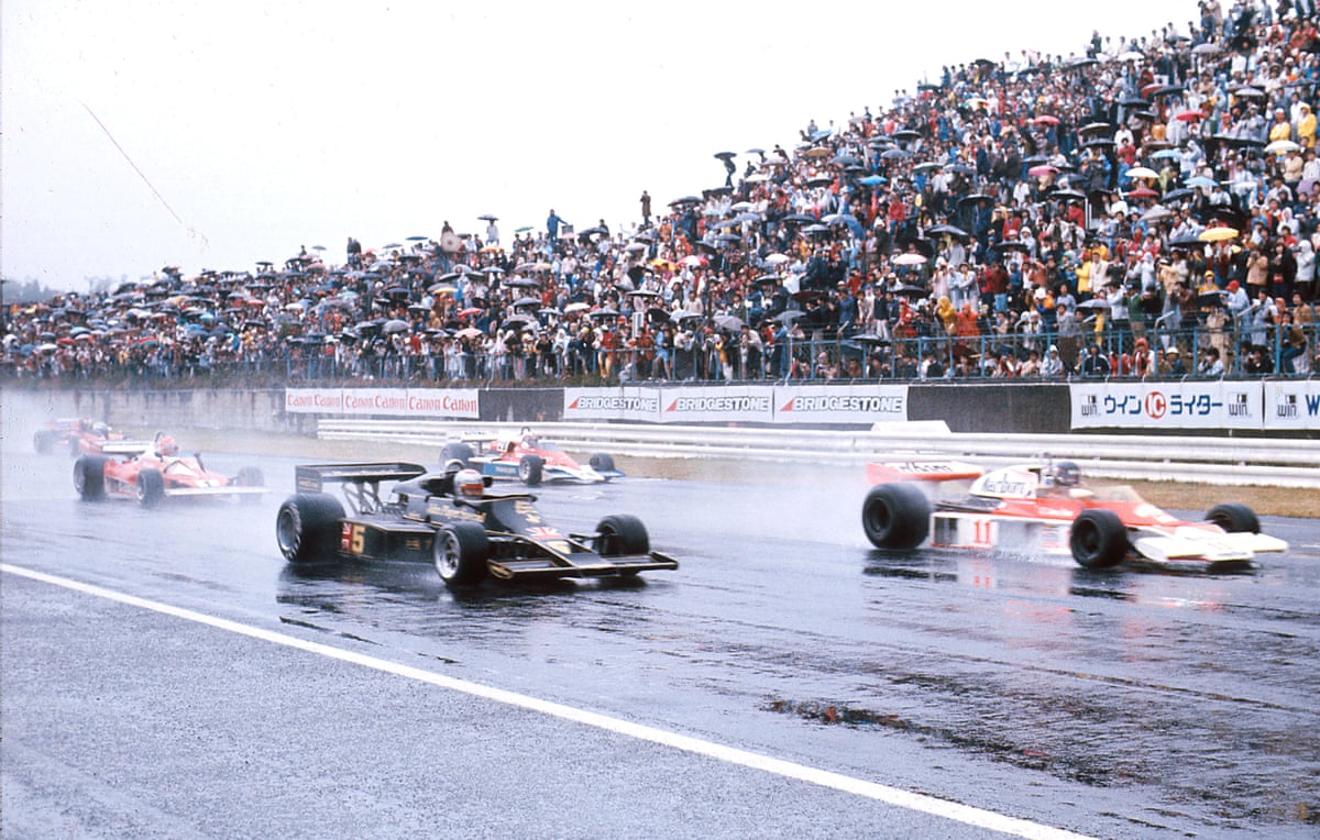 James Hunt and Mario Andretti lead away from the front row at the start