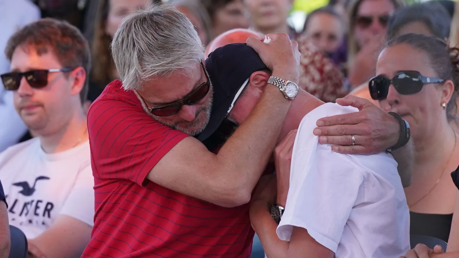 David and Barnaby's younger brother Charlie at a vigil at the University of Nottingham, following the attacks