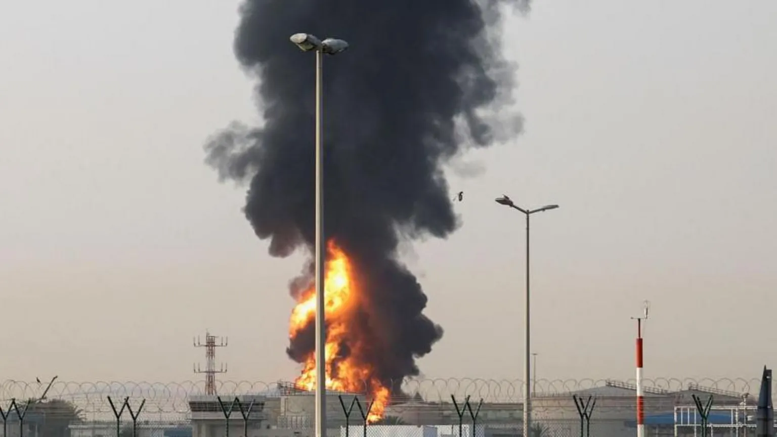 Shutterstock Smoke rises from an area near Dubai International Airport in Dubai, following what the United Araba Emirates says was a