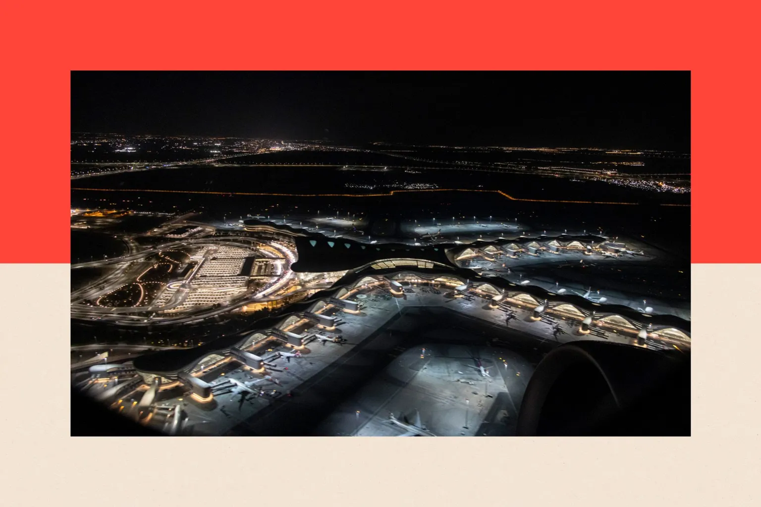 NurPhoto via An aerial night view from a departing airplane window shows h multiple aircrafts parked at the Zayed International Airport.