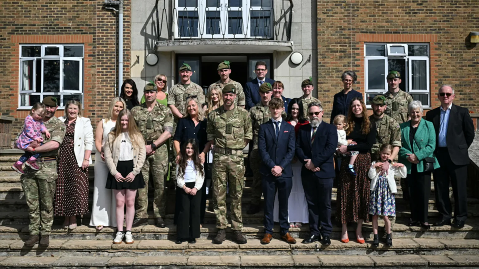 JUSTIN TALLIS/Pool via Britain's Prince William, Prince of Wales as Colonel-in-Chief of the Regiment, poses with soldiers of the 1st Battalion Mercian Regiment and family members following their six-month deployment to Estonia, in Bulford, Britain, March 26, 2026. JUSTIN TALLIS/Pool via 