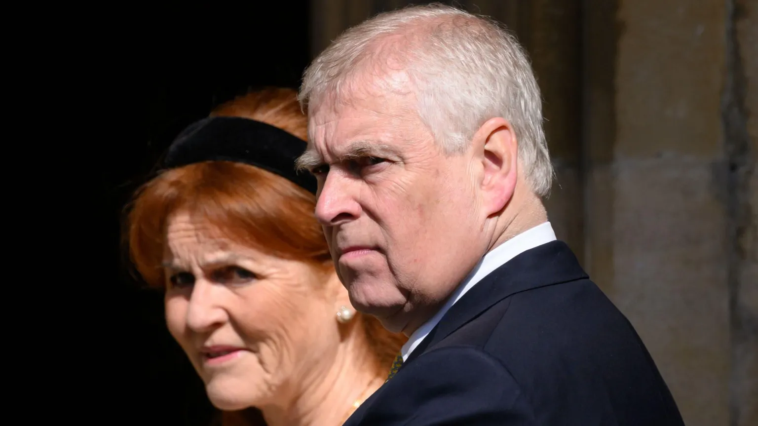  A file photo from the 2025 Easter Service at St George's Chapel in Windsor of the then-Prince Andrew, wearing a dark suit and pictured in a three-quarter view, with Sarah Ferguson, who has a black Alice band in her hair, standing behind him 