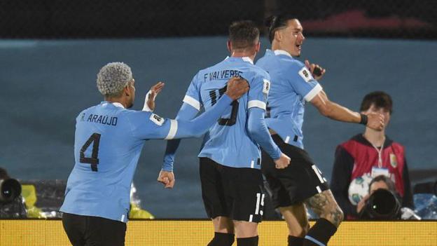 Uruguay players celebrate scoring a goal