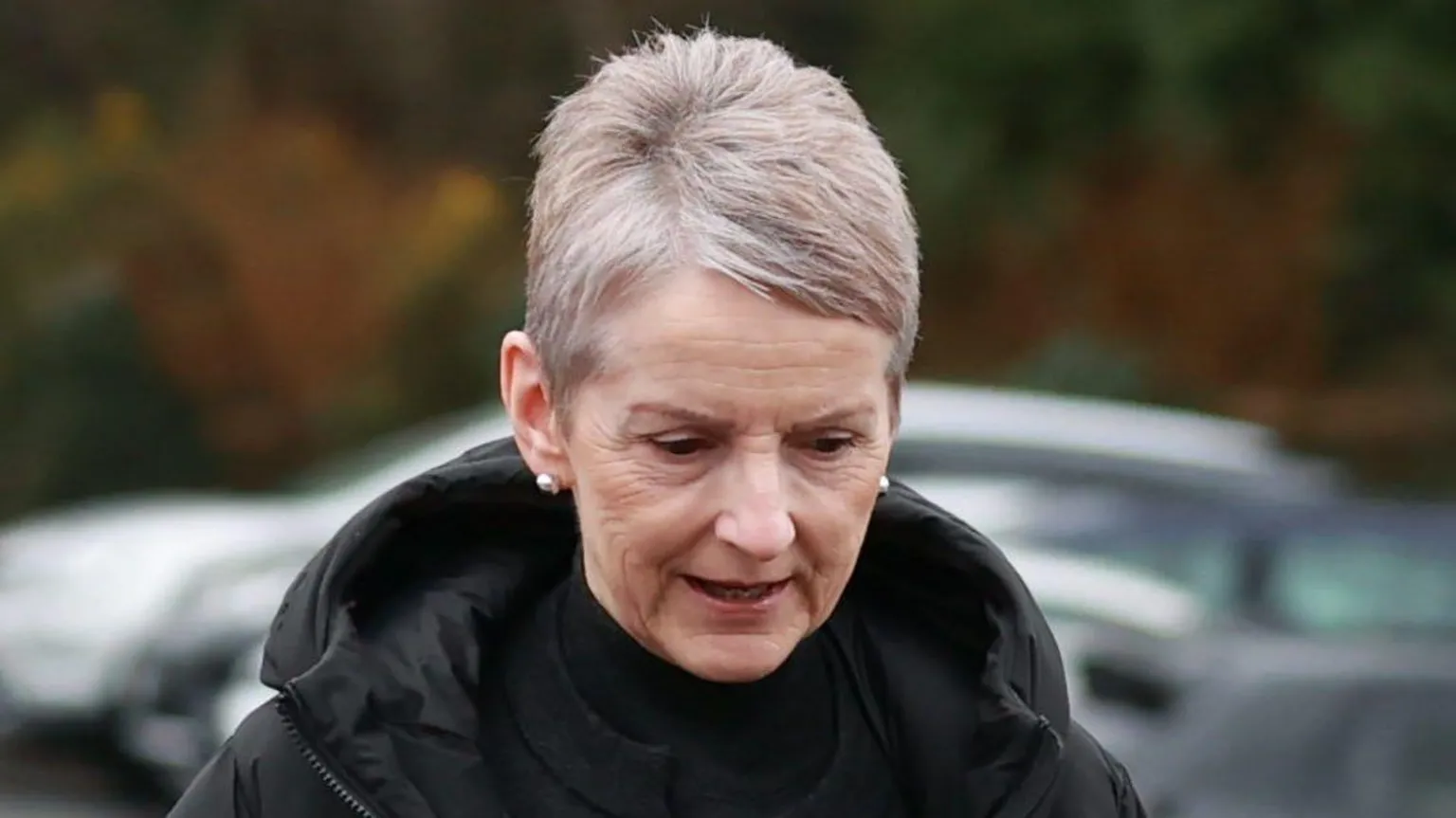  Lady Donaldson, with short grey hair, wearing a black top and black coat. 