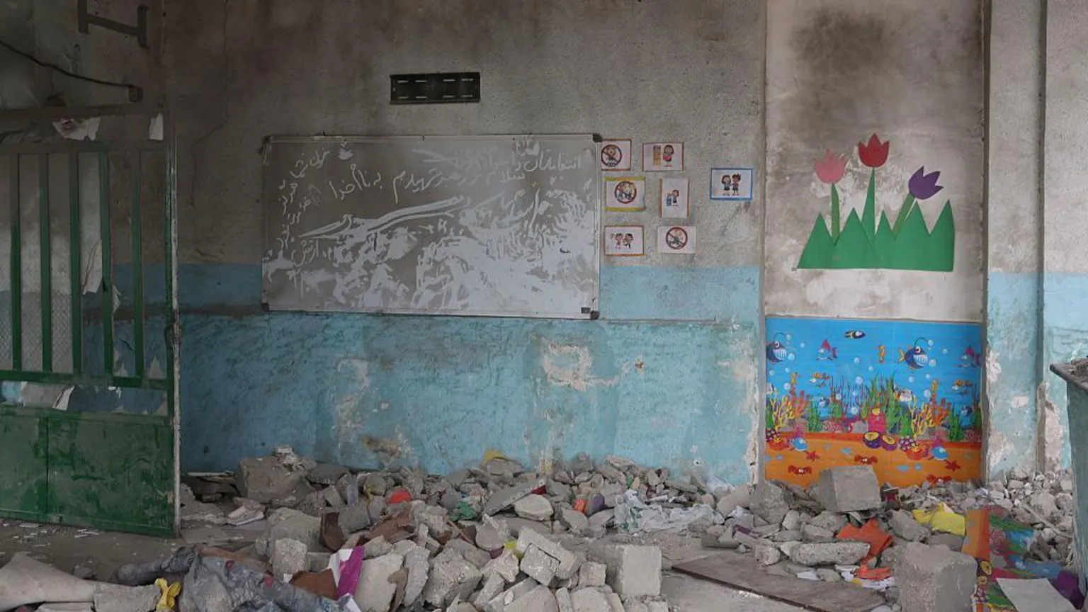 Anadolu via Images from the scene show bombed out classrooms covered in rubble. 