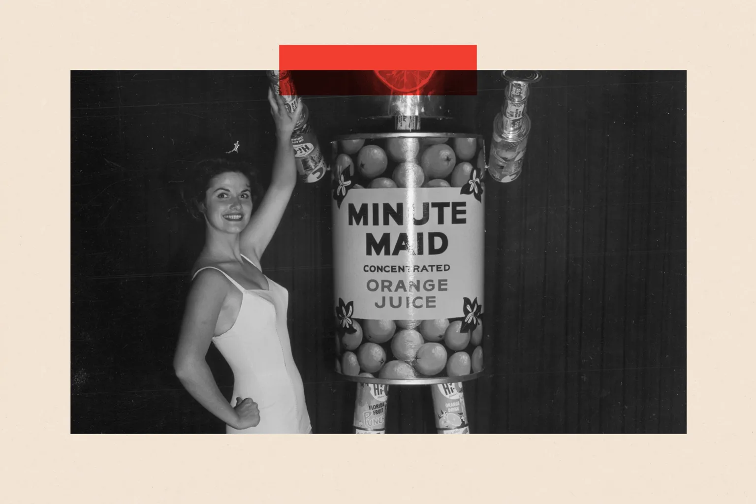Hulton Archive/ Full-length portrait of Marilyn Crane posing with Minute Maid's 'Mechanical Man' made from aluminum cans of orange juice