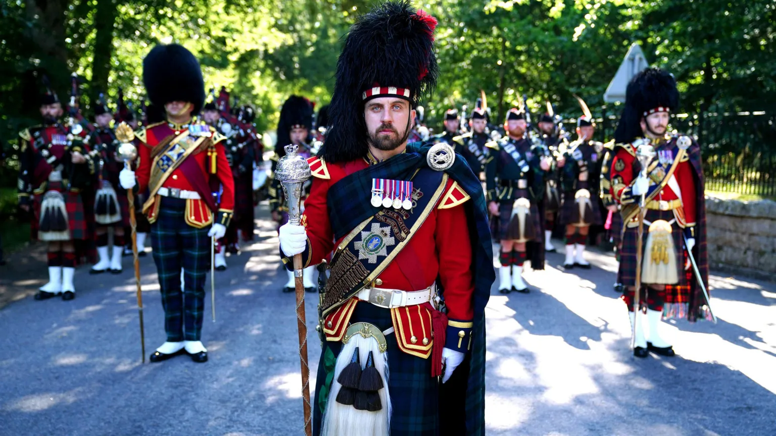  The pipe band of 3 & 4 SCOTS, Royal Regiment of Scotland at the gates of Balmoral ahead of an inspection by King Charles III
