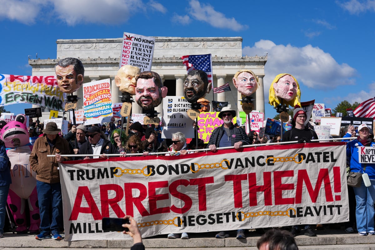 Demonstrators hold effigies of Trump administration officials as they gather at the Lincoln Memorial during the