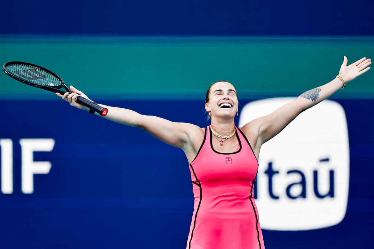 Aryna Sabalenka stretches her arms out and smiles as she takes in beating Coco Gauff