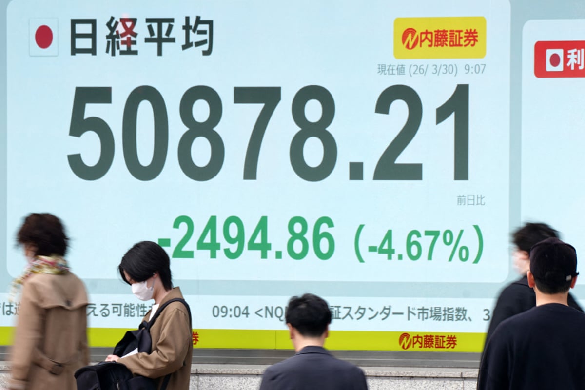 An electronic quotation board displays the Nikkei Stock Average on the Tokyo Stock Exchange.