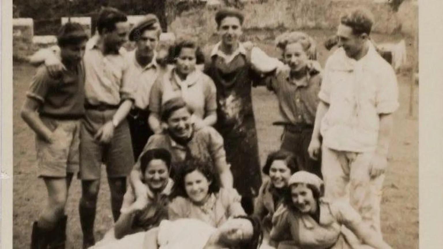 Gwrych Castle Trust Archive Black and white picture of kids in the garden. They smile with their arms aorund each other