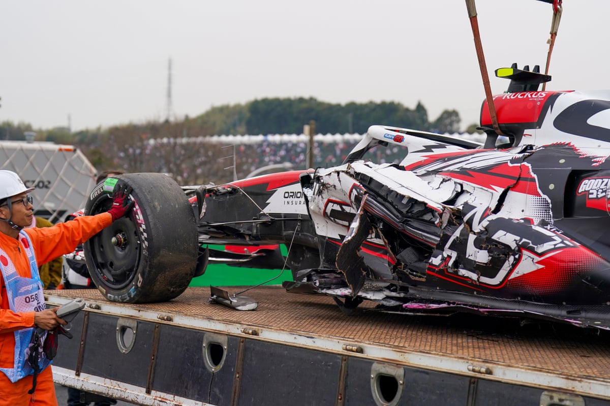 Oliver Bearman’s Haas on a tow truck after the crash in Suzuka.