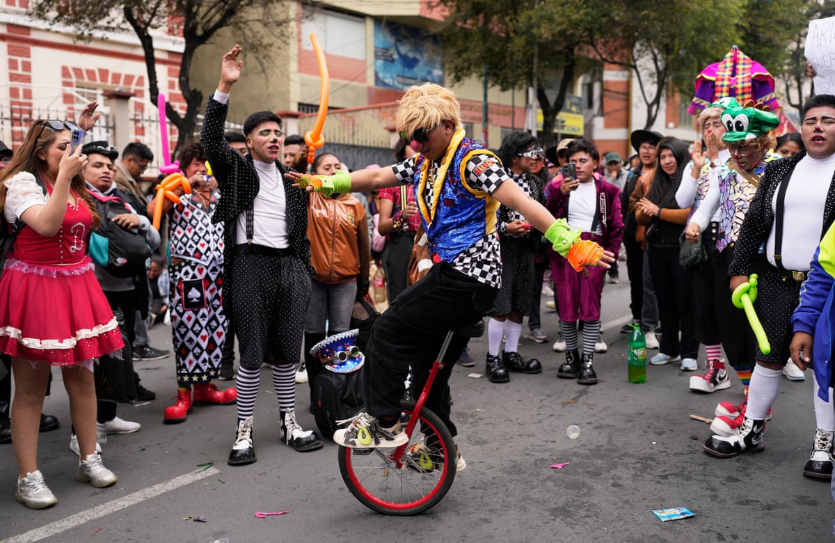 A clown rides a unicycle during a protest in La Paz against the government's ban on holiday parties at schools during teaching hours.