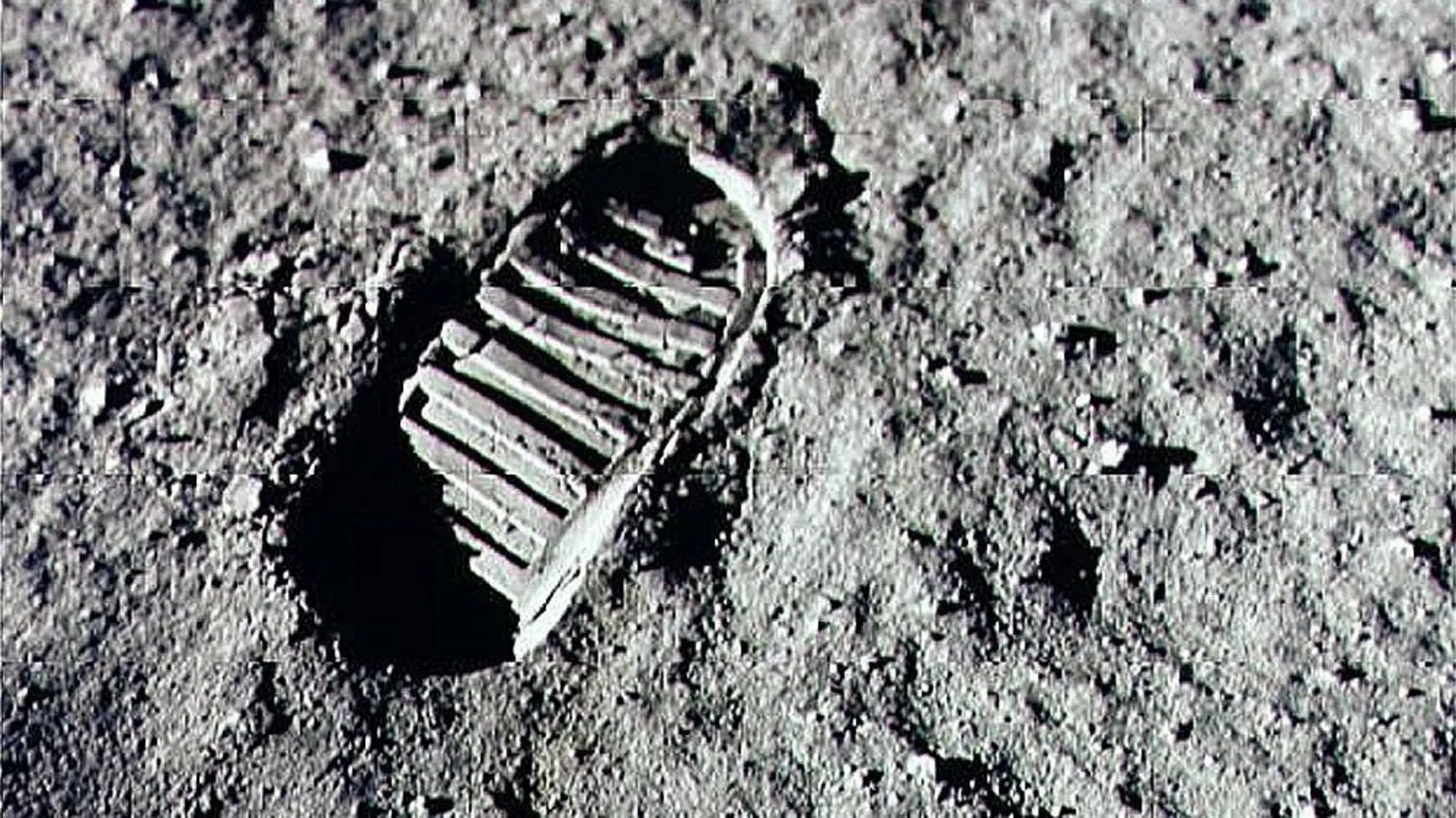 NASA/Newsmakers Neil Armstrong's human footprint on the surface of the moon in black and white 