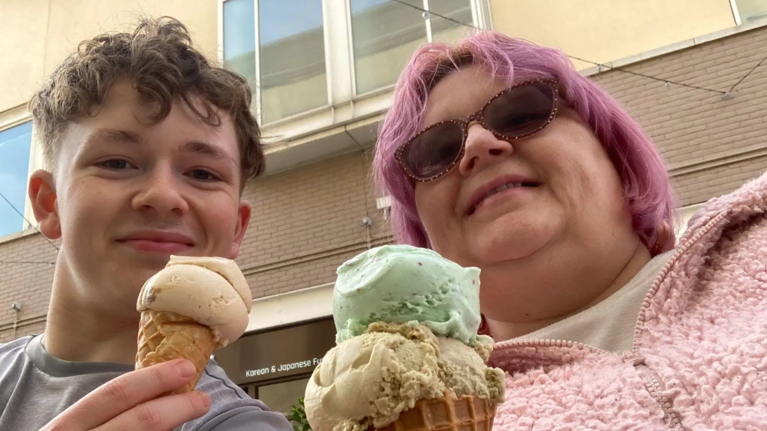 Albie Sutton Albie and Helen Sutton. They are smiling at the camera holding ice creams