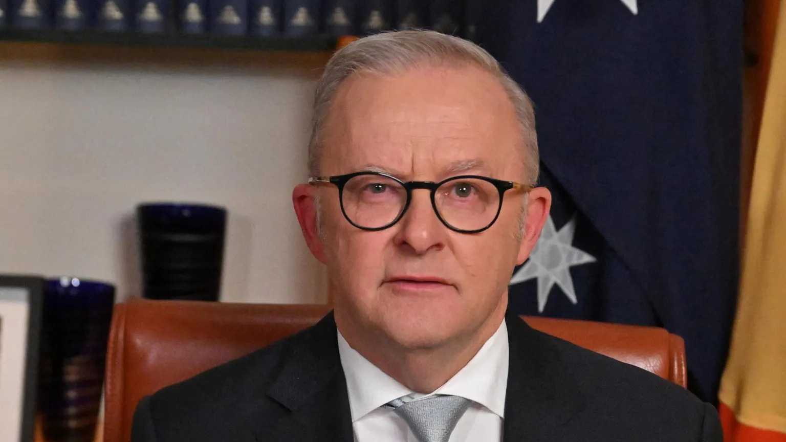  Australian Prime Minister Anthony Albanese reacts after delivering a pre-recorded address to the nation in his office at Parliament House, Canberra