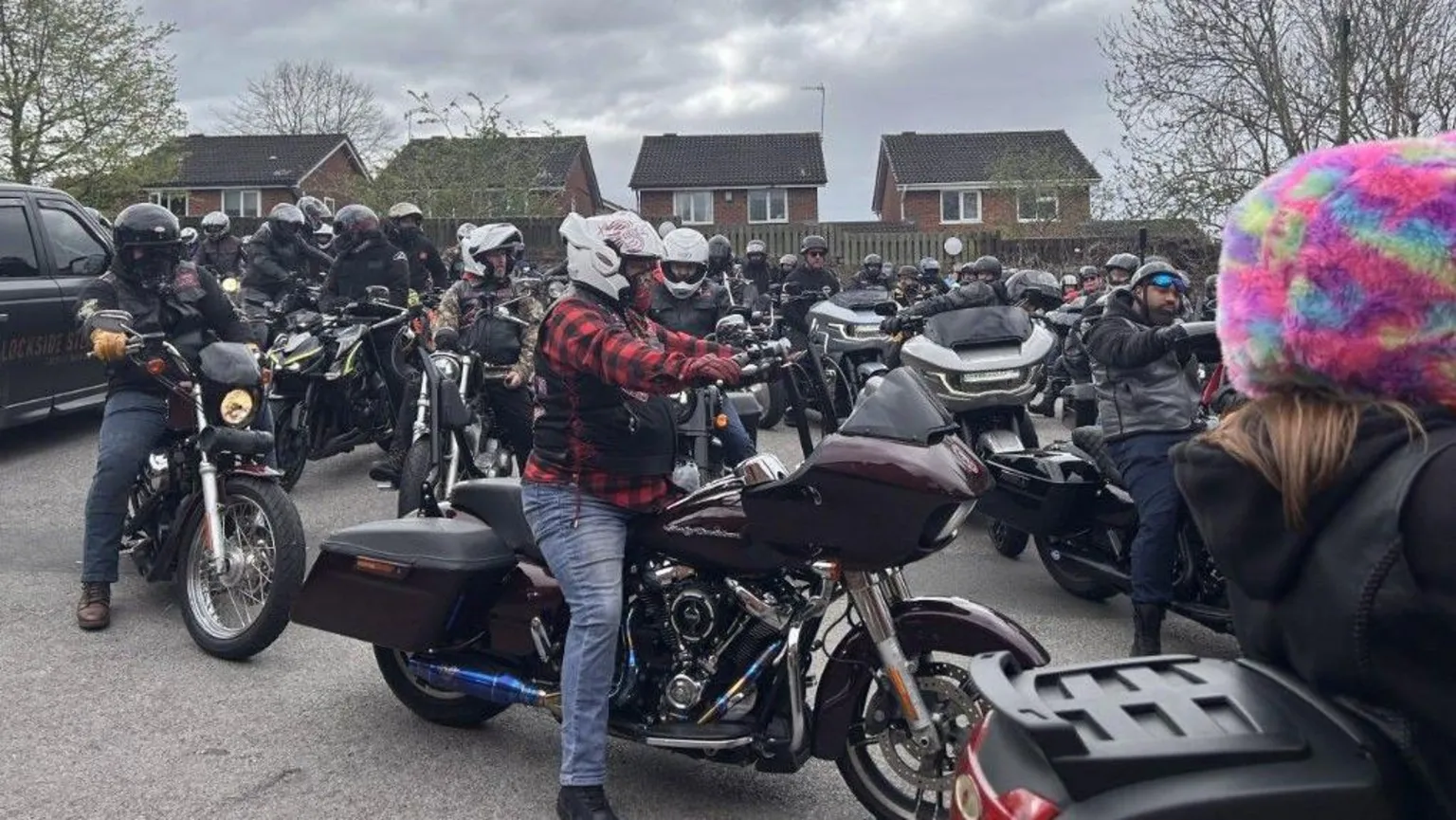 Dozens of bikers assemble in a car park ahead of the funeral.