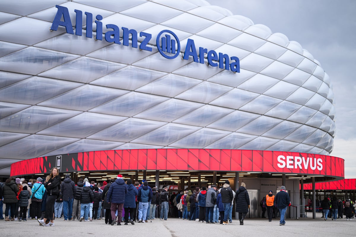 Supporters queue up to enter the Allianz Arena prior to the Women's Champions League quarter-final match between Bayern Munich and Manchester United