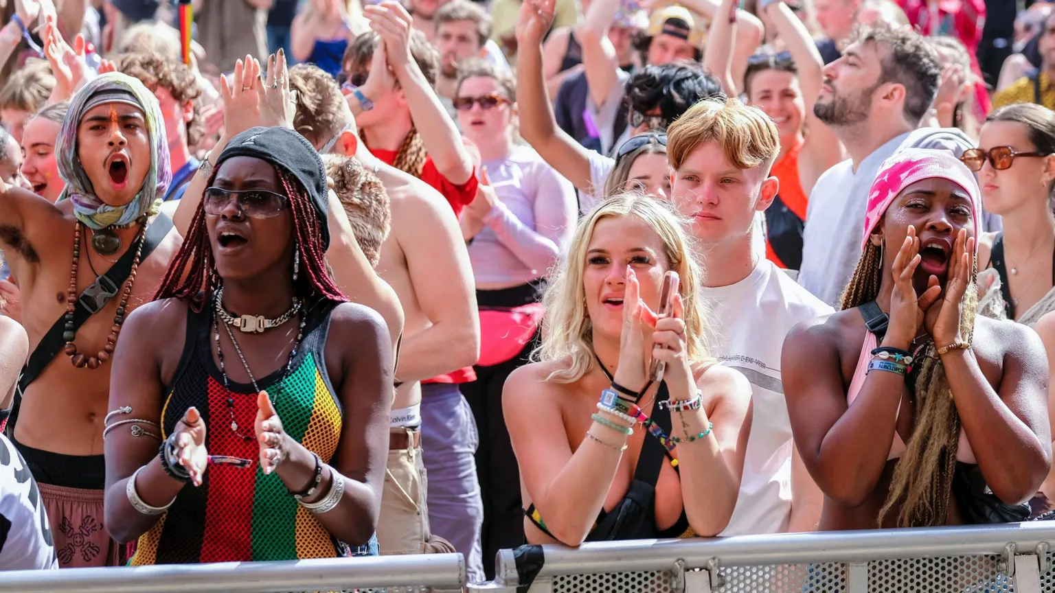  Crowds of people enjoy live music at Boomtown Fair Festival in the South Downs National Park, near Winchester, Hampshire