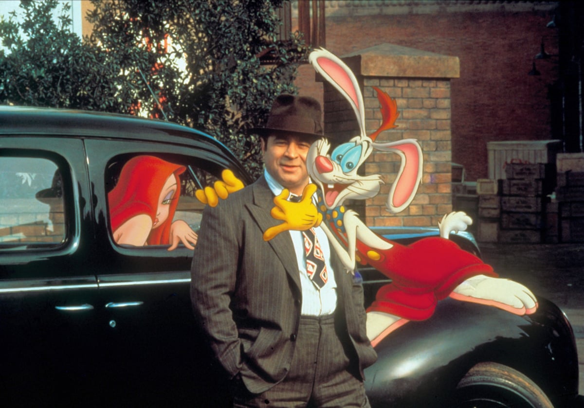 Jessica Rabbit (voiced by Kathleen Turner) Bob Hoskins as Eddie Valiant and Roger Rabbit (voiced by Charles Fleischer) in Who Framed Roger Rabbit.
