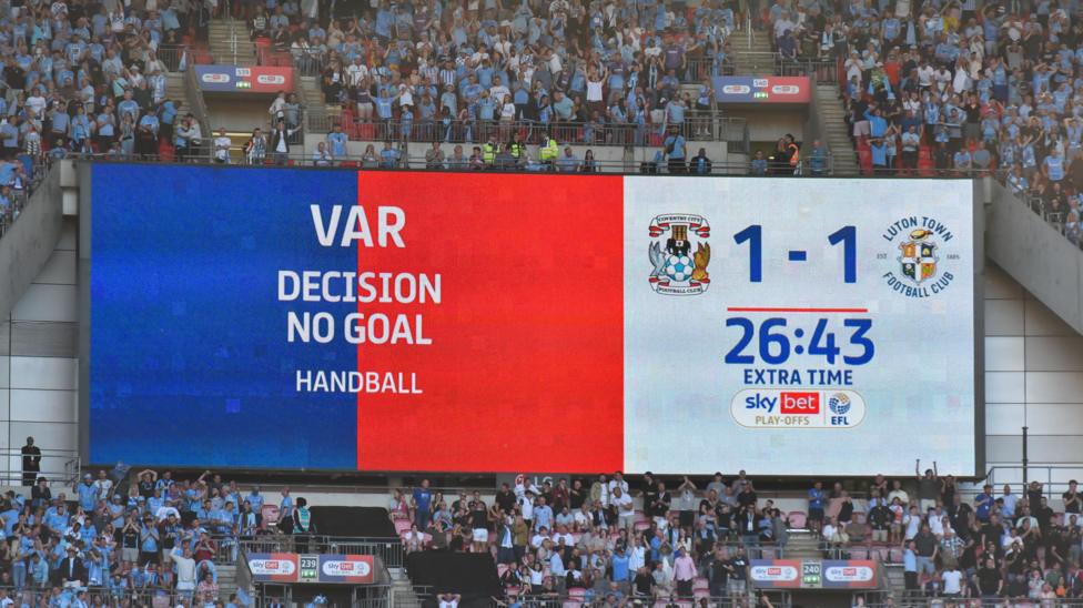The big screen at Wembley showing 'VAR decision no goal, handball' during the Championship play-off final between Coventry and Luton in 2023