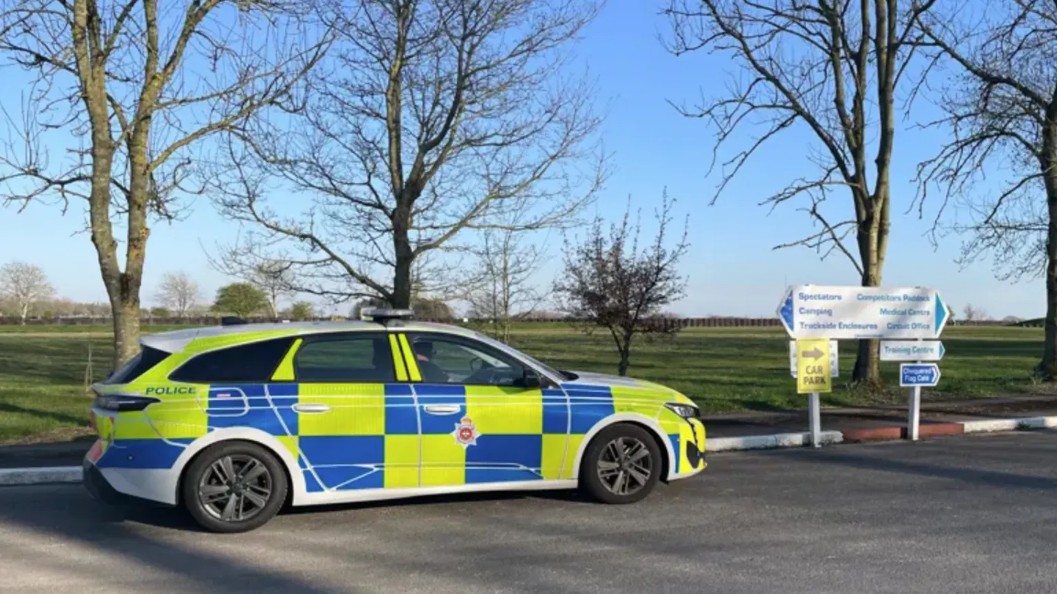 A police car on the side of a road