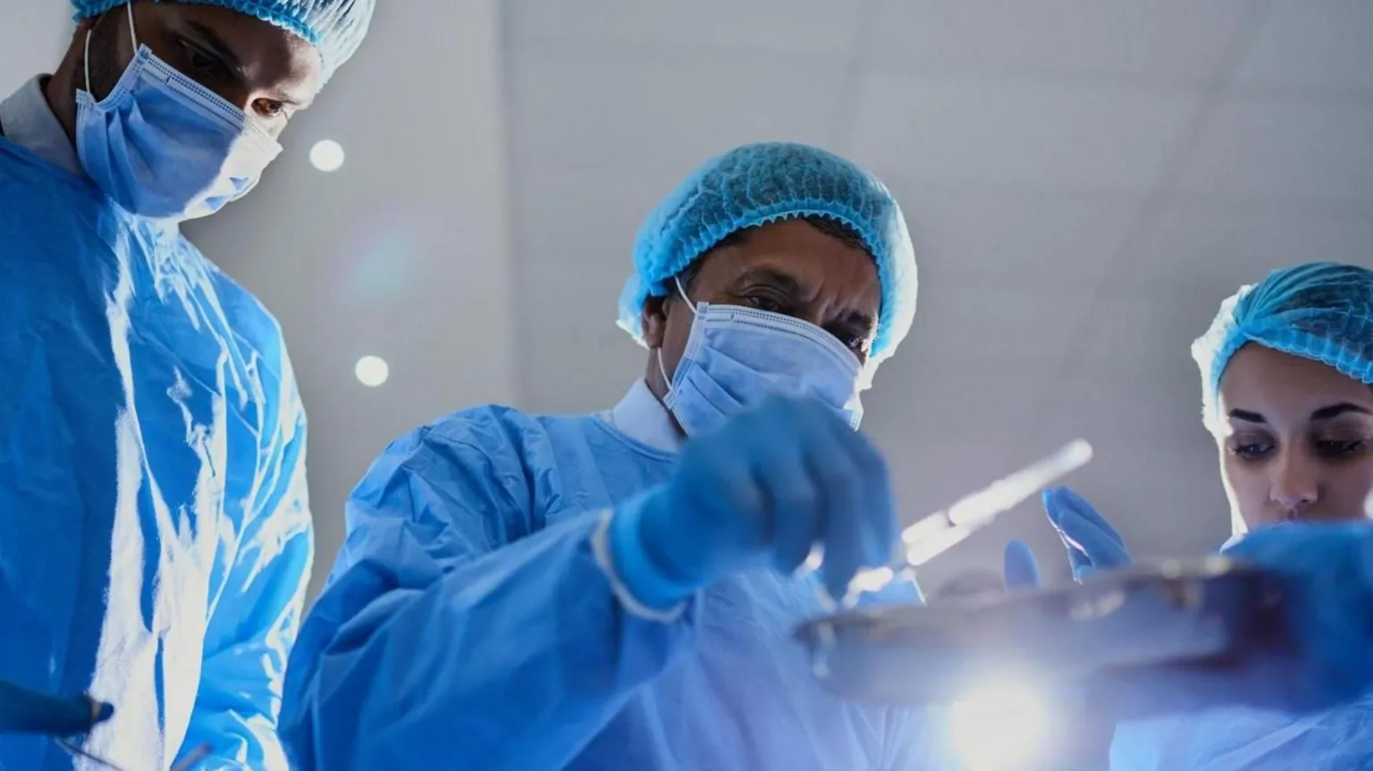  Generic image of surgeons in scrubs during an operation