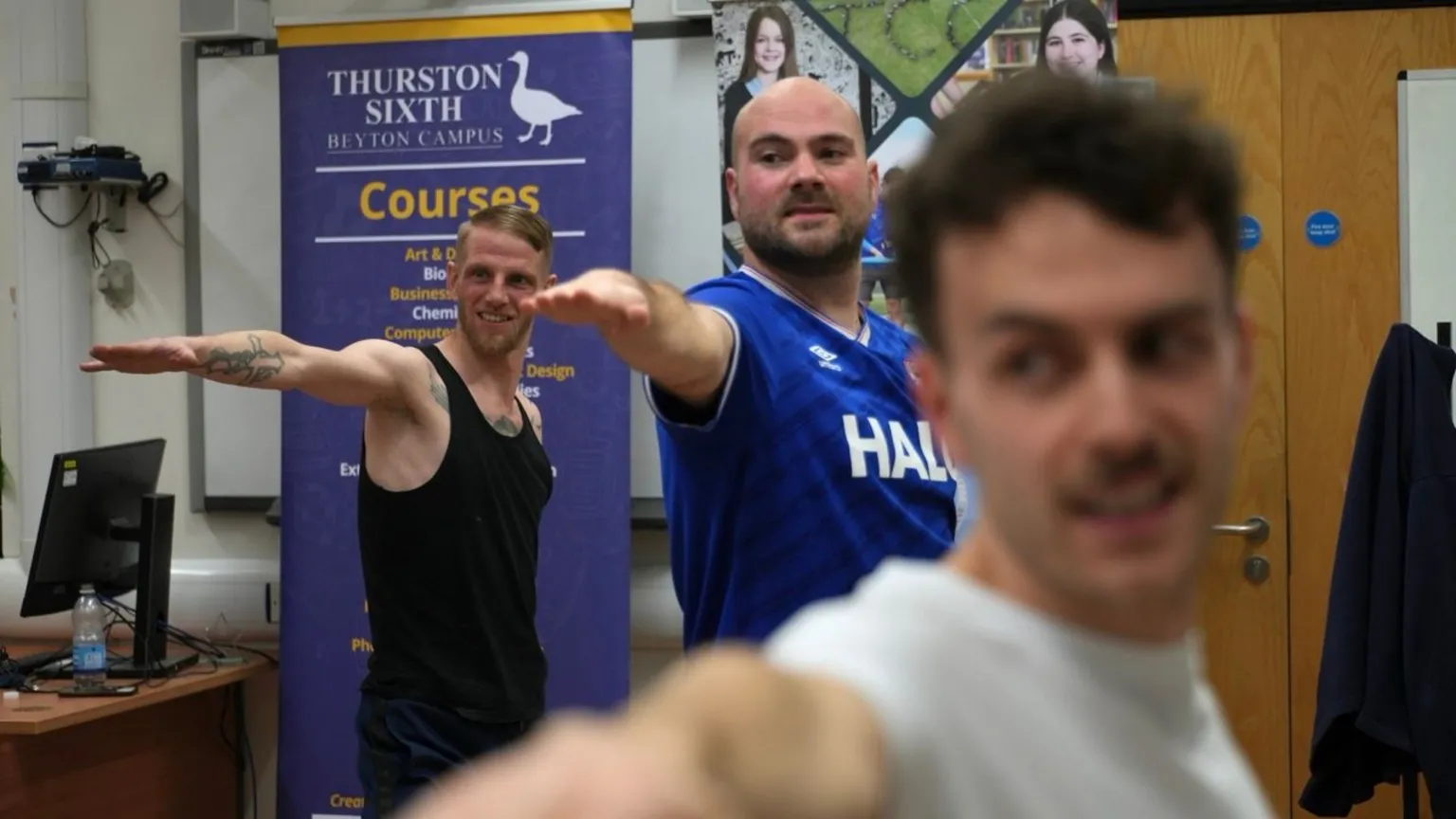 John Fairhall/ BBC Three members of the group performing the 