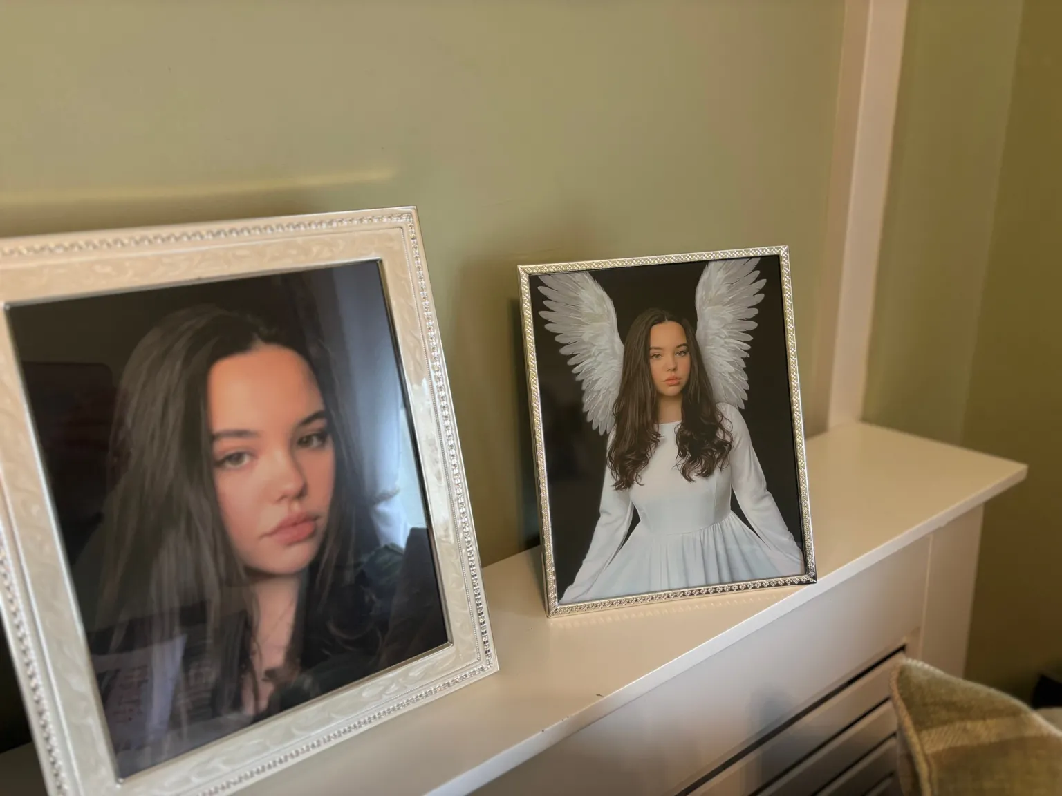 Framed photographs of a teenage girl standing on a shelf 