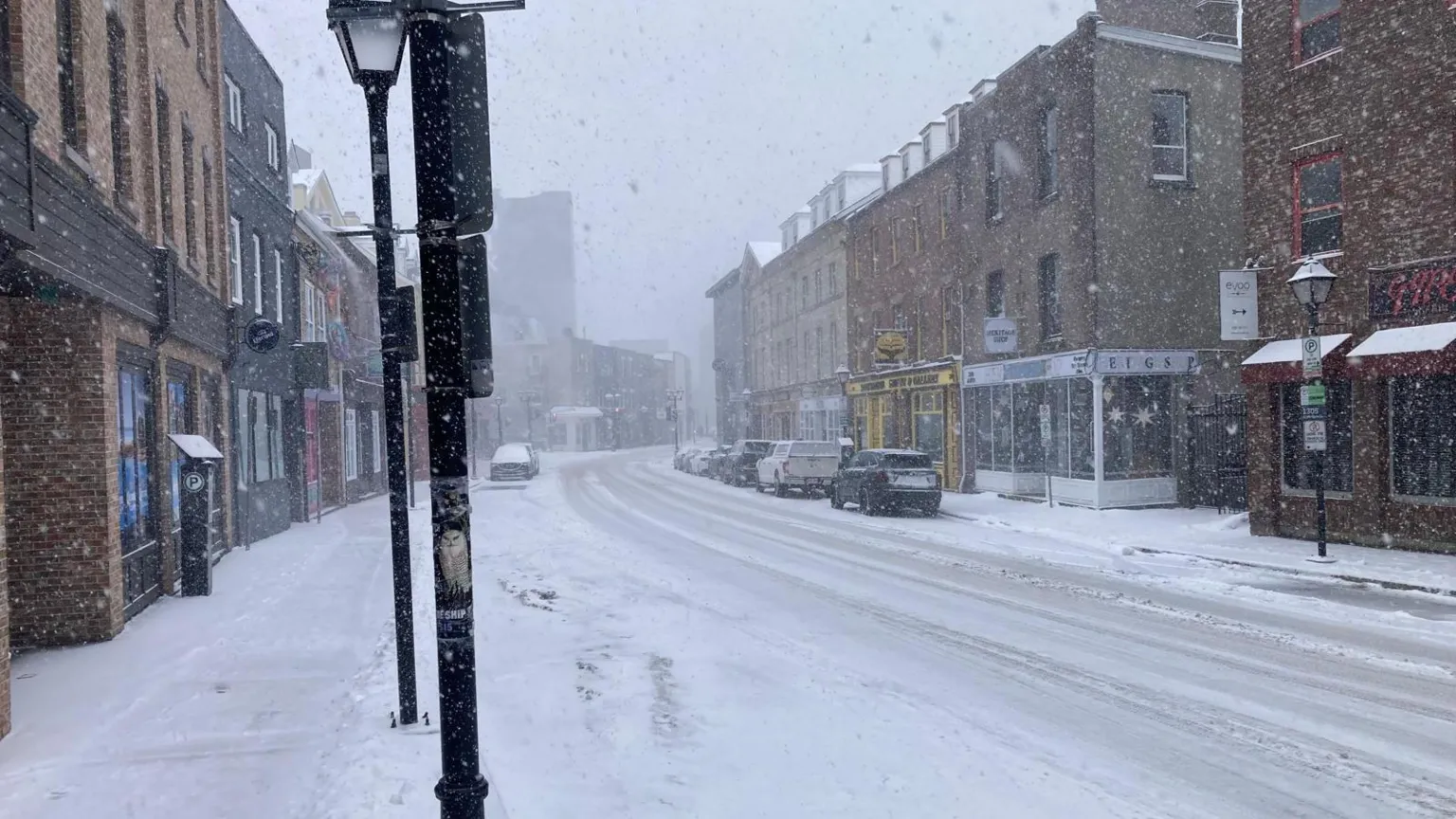 Jon Shipman A street in Newfoundland covered in snow. Cars can be seen on either side of the street. 