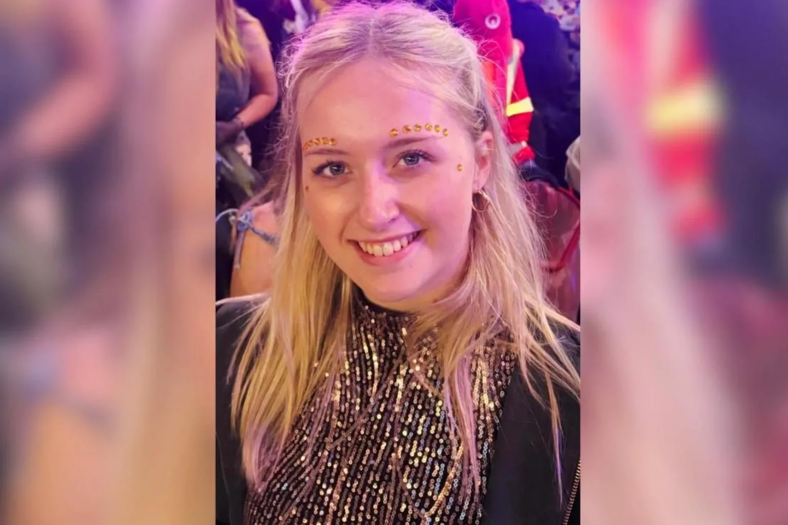 Meg Draper A woman has gold sequences above her eyebrows smiling at the camera. It is a head and shoulders shot. She wears a sparkly gold top.