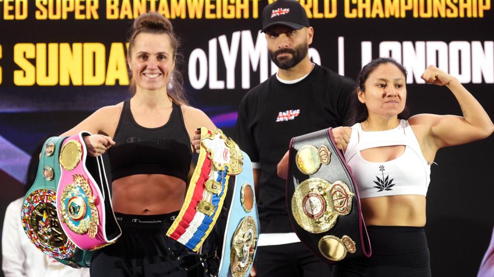 Ellie Scotney and Mayelli Flores pose with their belts