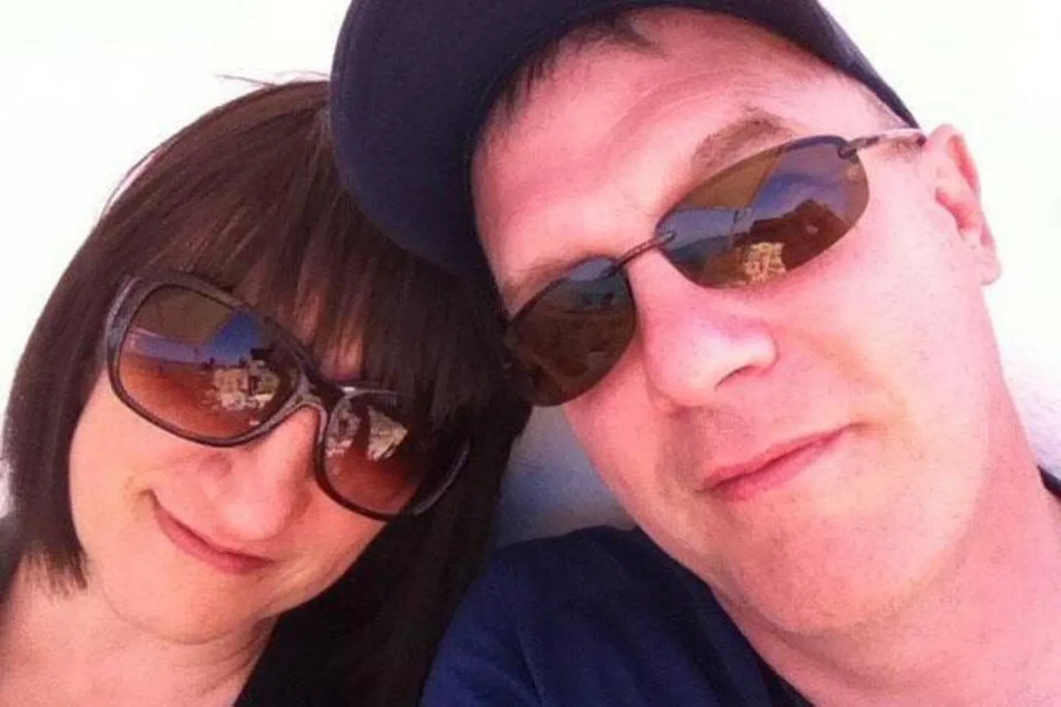 Chris Daniel Chris and Rita pictured together. Rita had short brown hair and was wearing brown sunglasses. Chris was wearing a blue baseball cap and sunglasses.