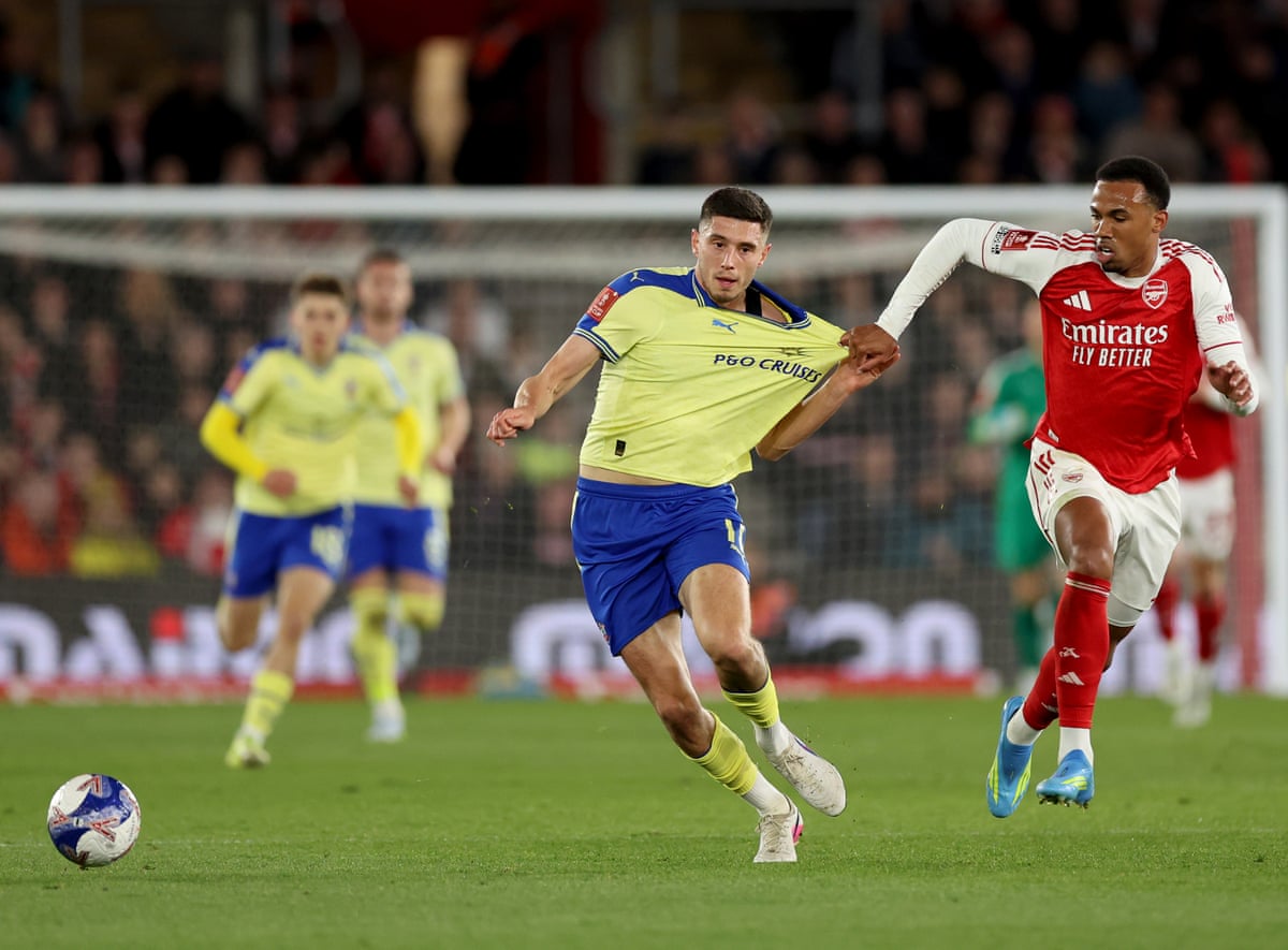 Gabriel pulls Ross Stewart's shirt.