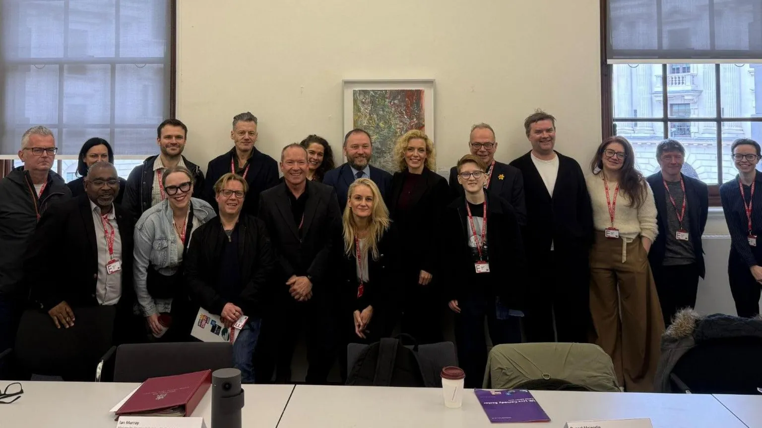 Office of Dr Simon Opher MP Several members of a delegation from the comedy sector stood in a line posing for a photo with minister Ian Murray.