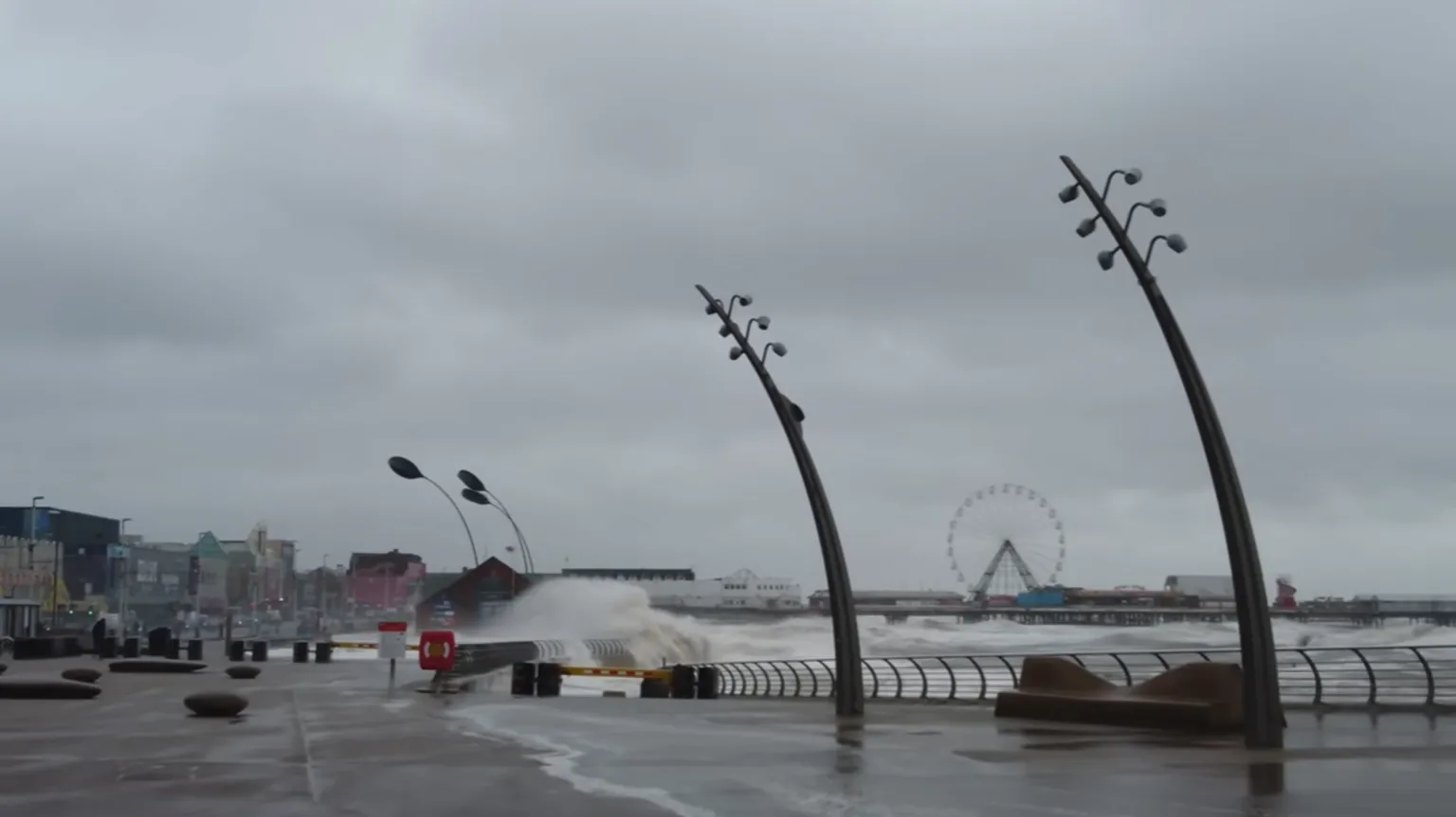 The Blackpool Lads A giant wave can be seen splashing near the Promenade, with waves splashing over the promenade too.
