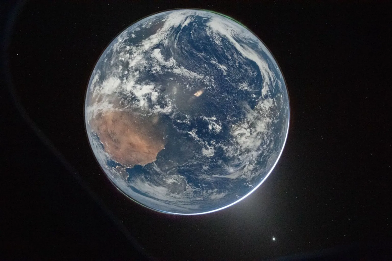 NASA/Reid Wiseman NASA astronaut and Artemis II Commander Reid Wiseman took this picture of Earth from the Orion spacecraft's window on April 2, 2026, after completing the translunar injection burn.