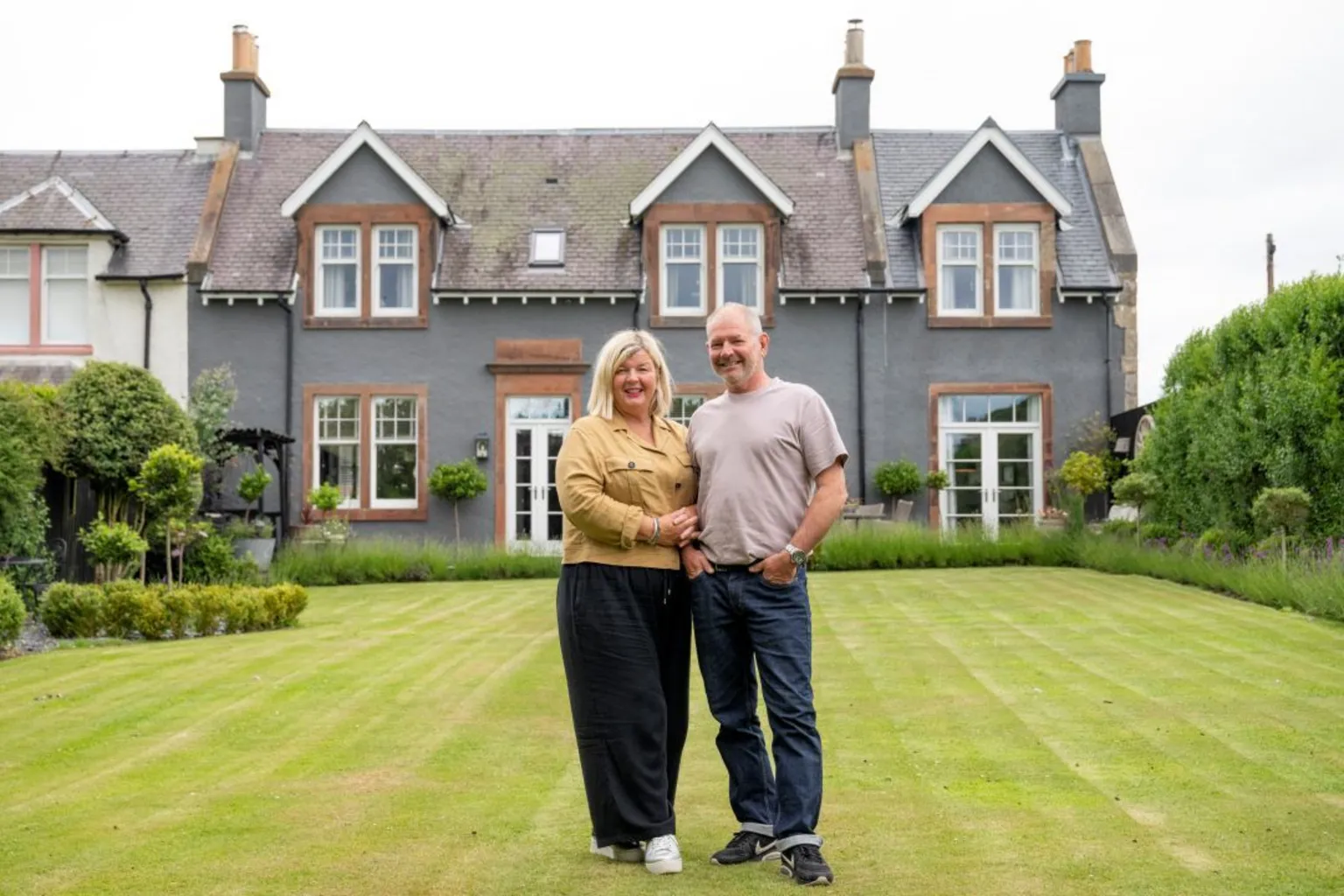 IWC Media Diane and Jimmy standing in front of The Schoolhouse.