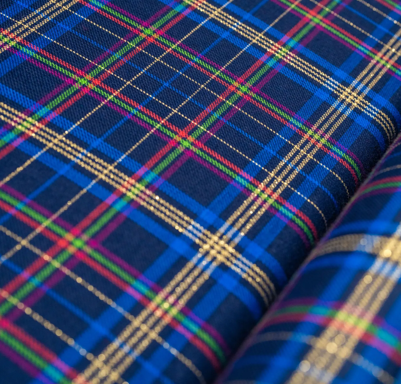 A blue red gold and pink tartan