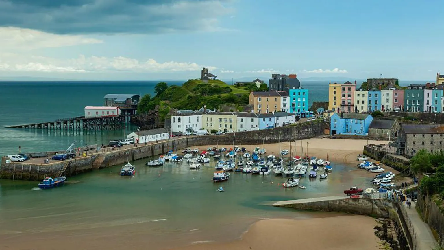  A picture of Tenby harbour with different coloured houses situated above it