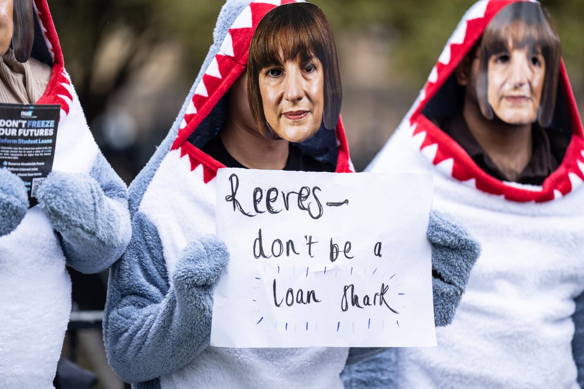 Student protesters dressed as sharks hold up a sign that says: Reeves, don't be a loan shark