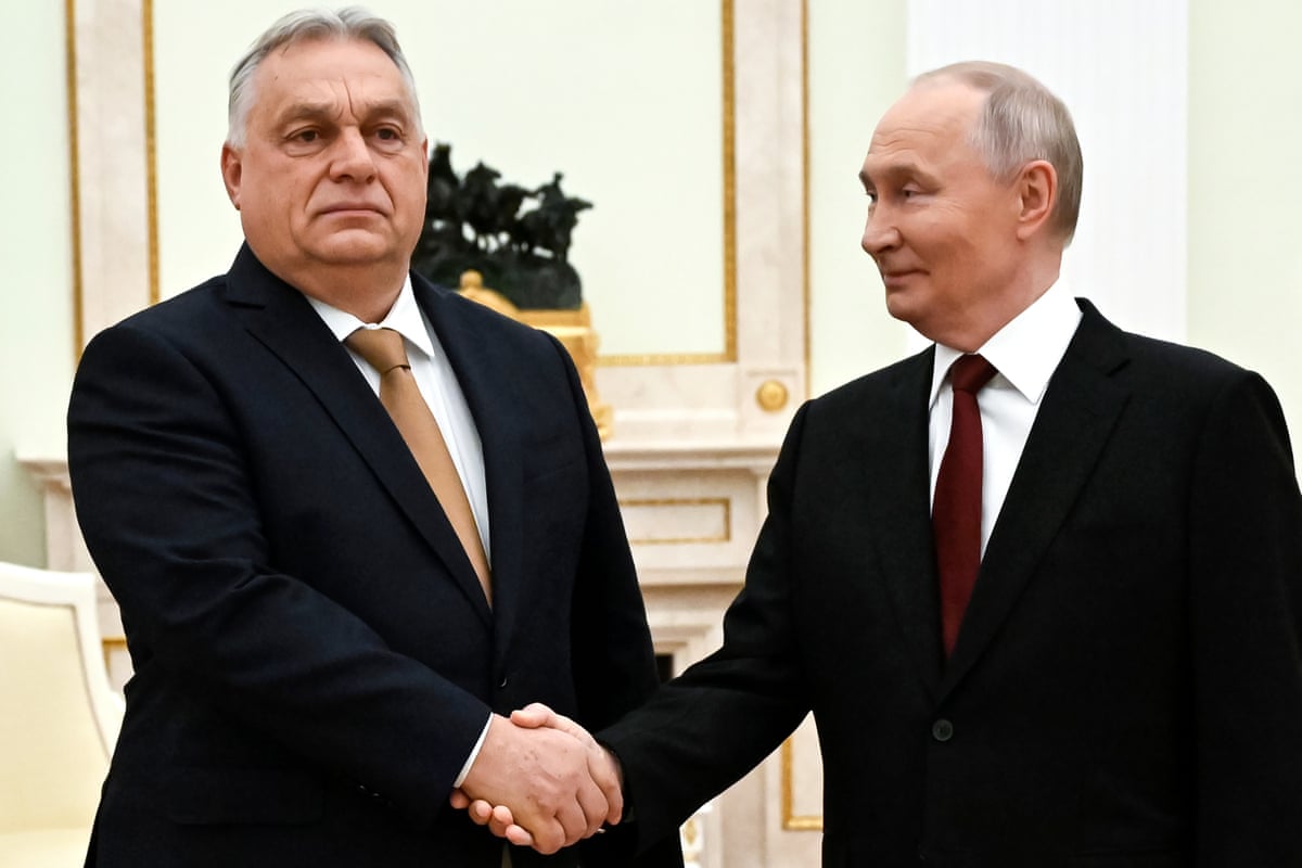 Viktor Orbán and Vladmir Putin shake hands as they pose for a photograph