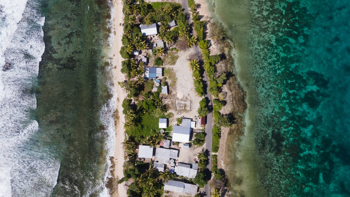 Homes on a narrow strip of land with ocean on both sides