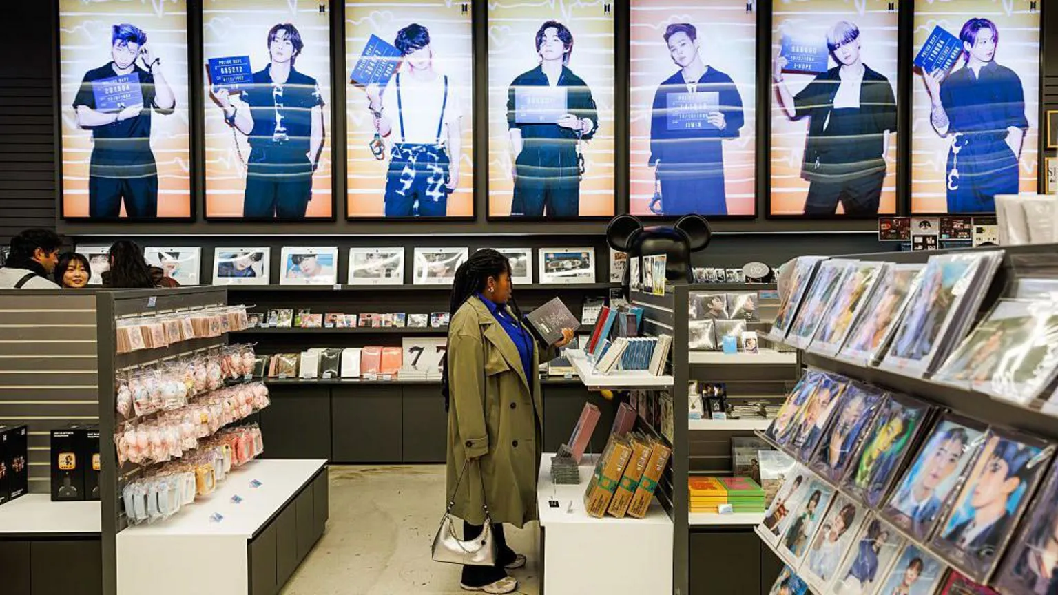  Customers browse K-pop band BTS merchandise at a souvenir store in Seoul, South Korea, on Wednesday, March 18, 2026