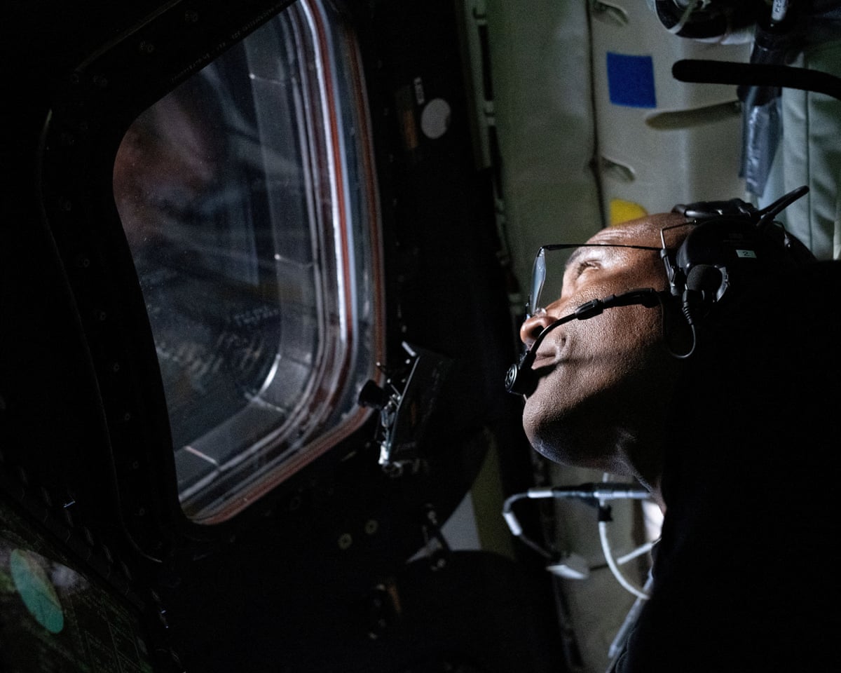 Artemis II pilot Victor Glover is pictured looking out of the window on the Orion spacecraft during the lunar flyby on Monday.