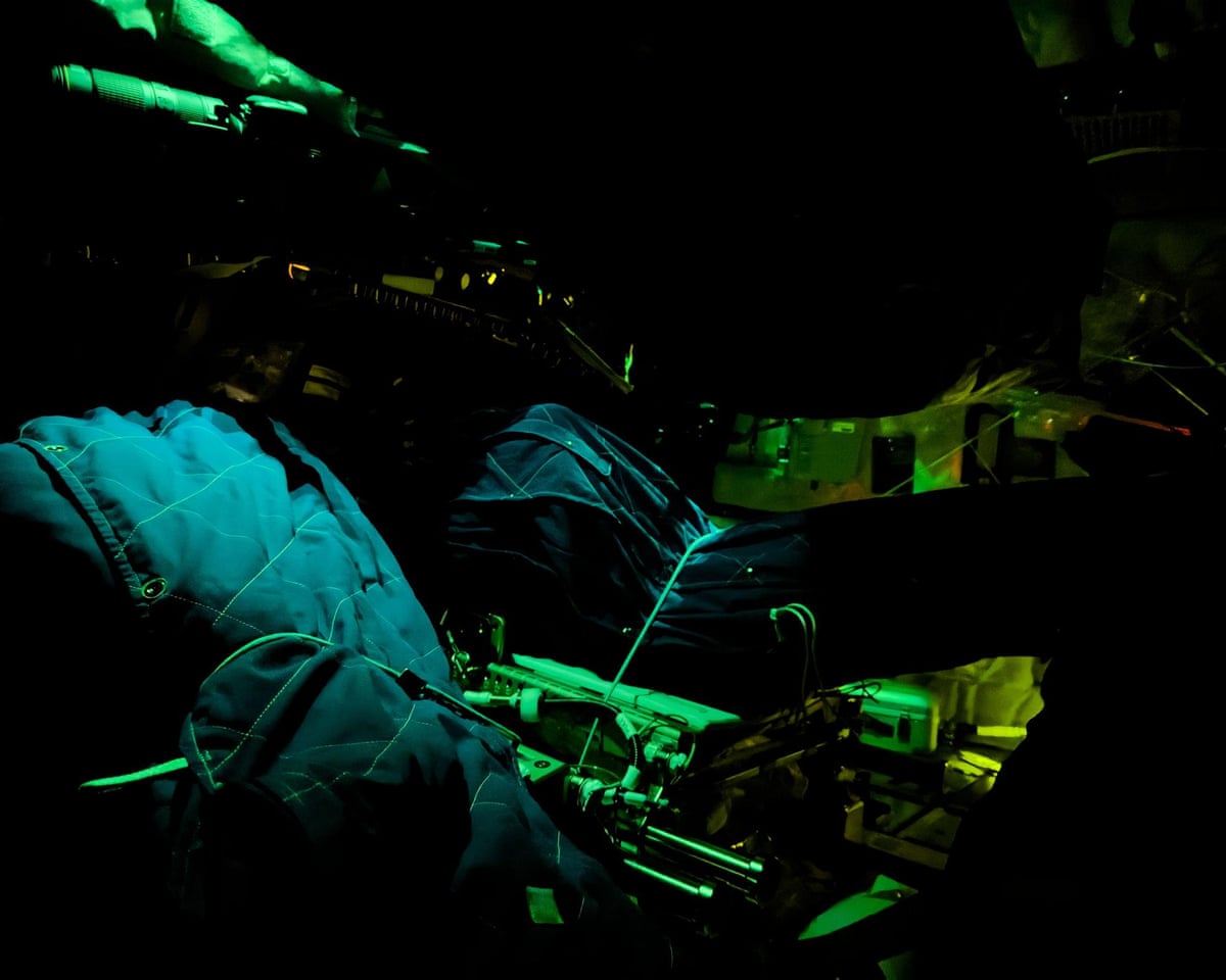 The crew’s sleeping bags are illuminated inside the Orion spacecraft.