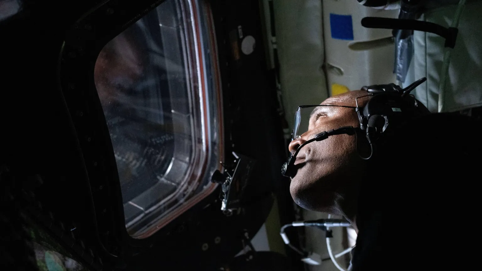 NASA Victor Glover looks out of the window of the Orion spacecraft